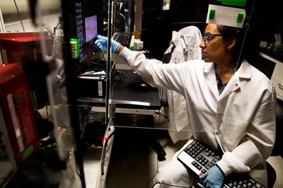 Stacy Ramcharan, a doctoral student in chemical engineering, uses a computerized system to layer polymer fibers, forming a scaffold for growing cells into artificial tissues. Photo: Joseph Xu, Michigan Engineering Communications & Marketing. Stacy Ramcharan, a doctoral student in chemical engineering, uses a computerized system to layer polymer fibers, forming a scaffold for growing cells into artificial tissues. Photo: Joseph Xu, Michigan Engineering Communications & Marketing.
