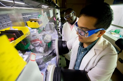 Pierre Ferdinand Poudeu-Poudeu, Associate Professor of Materials Science and Engineering (left) and MSE PhD student Alan Olvera seal off glass vacuum tubes during the process of constructing a stable copper selenide material. Photo: Joseph Xu/Senior Multimedia Content Producer, University of Michigan - College of Engineering